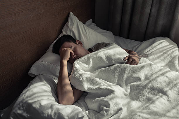 istock Man suffering from insomnia, sleep apnea. 2238390697