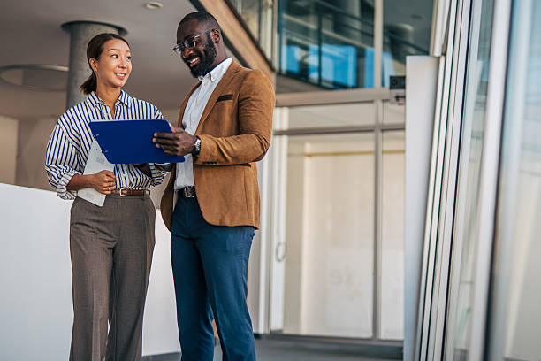 istock Diverse business professionals discussing documents in modern office 2238394562
