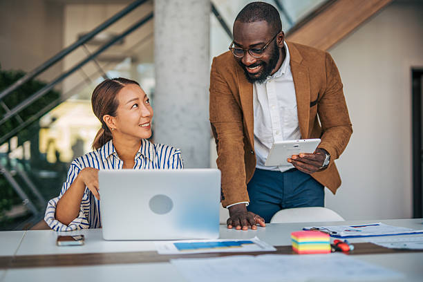 istock Diverse business people collaborating in modern office setting 2238395095