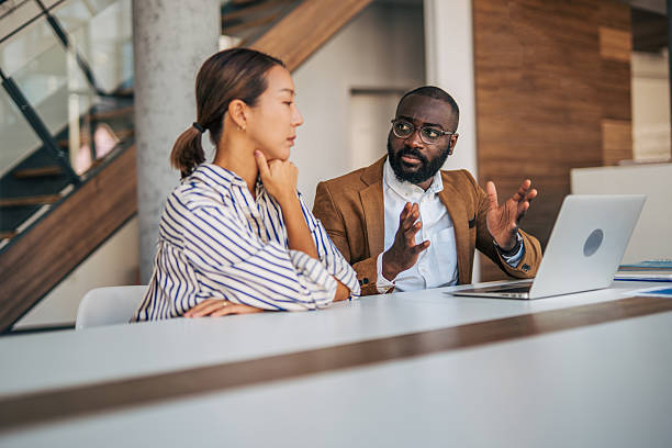 istock Diverse business people discussing ideas in modern office 2238395215