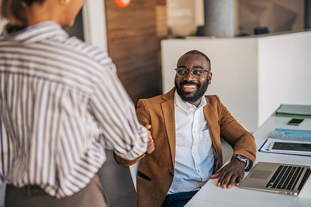 istock Business people shaking hands in office during meeting 2238395217