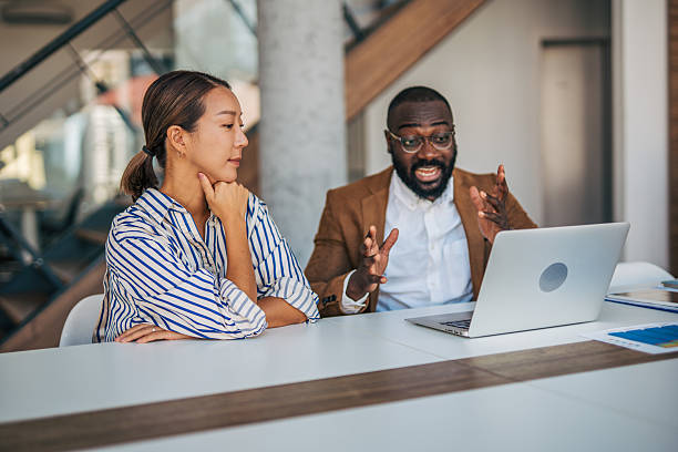 istock Diverse colleagues discussing business during a meeting in modern office 2238395368
