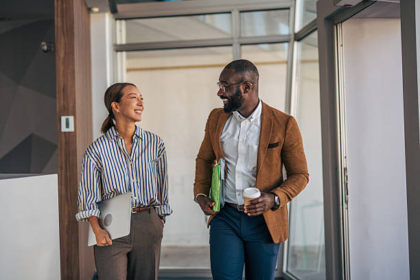 istock Diverse colleagues walking and discussing during office break 2238396994