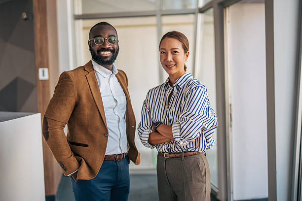 istock Business colleagues smiling in professional office environment 2238398653