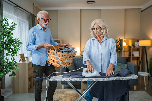 istock Senior couple sharing housework chores, ironing clothes 2238398748