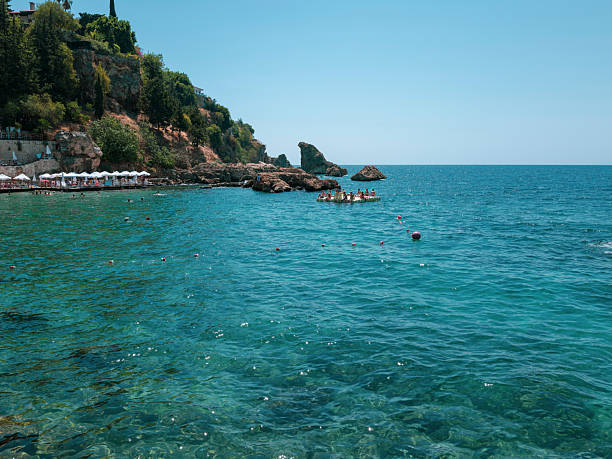 Antalya, Turkey - 08/21/2025: People enjoying vacation on Mediterranean beach