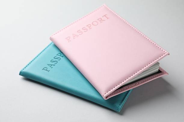 istock Passports in color covers on light background, closeup 2238402337