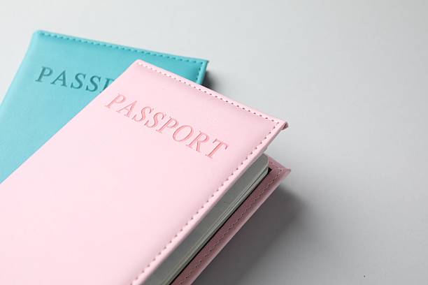 istock Passports in color covers on light background, closeup. Space for text 2238402362