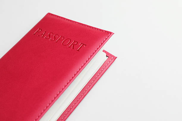 istock Passport in red cover on light background, closeup. Space for text 2238402384