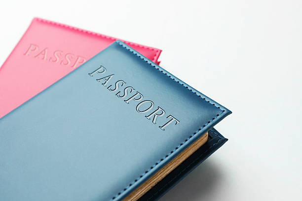 istock Passports in color covers on light background, closeup 2238402416