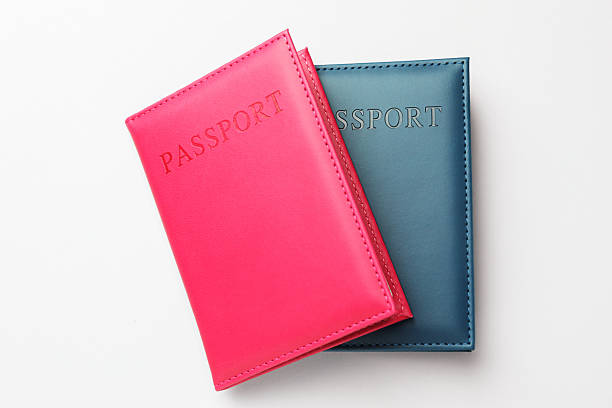 istock Passports in color covers on light background, top view 2238402420
