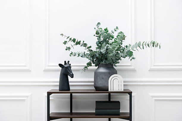 istock Console table with decor near white wall in room. Interior design 2238403164