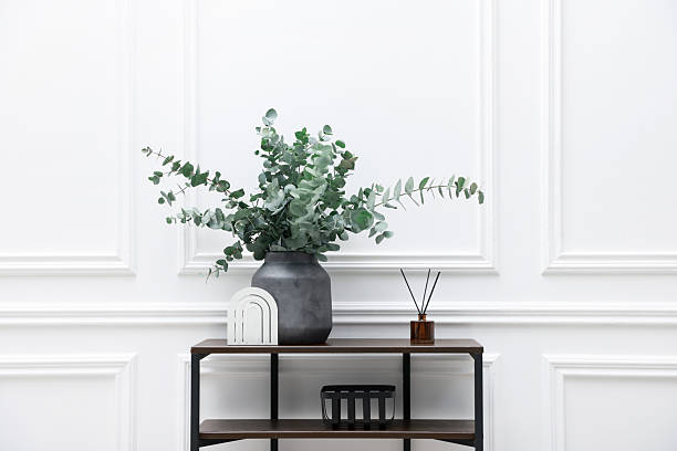 istock Console table with decor near white wall in room. Interior design 2238403168