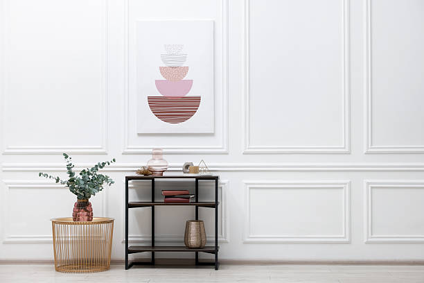 istock Console table with decor near white wall in room, space for text. Interior design 2238403183