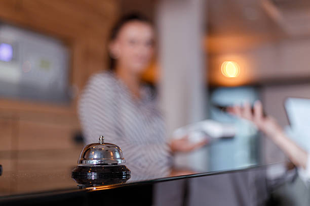 istock Front desk service at a hotel with a guest checking in 2238405846