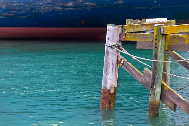 Old wharf in turquoise water. Colorful abstract composition with copy space.