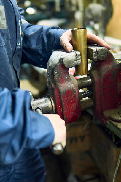 istock View of a Latina woman's hands working in a mechanical workshop, using machines and tools 2238409650