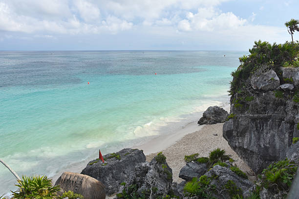 Mayan ruins above a beach located in Tulum Mexico