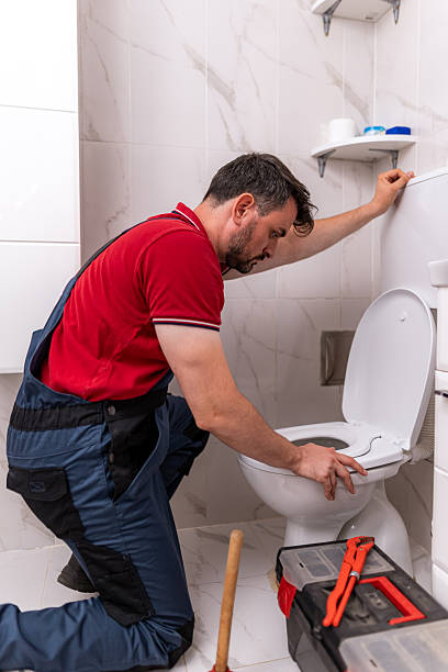 istock Plumbing repair work being done in a modern bathroom by a skilled technician 2238412820