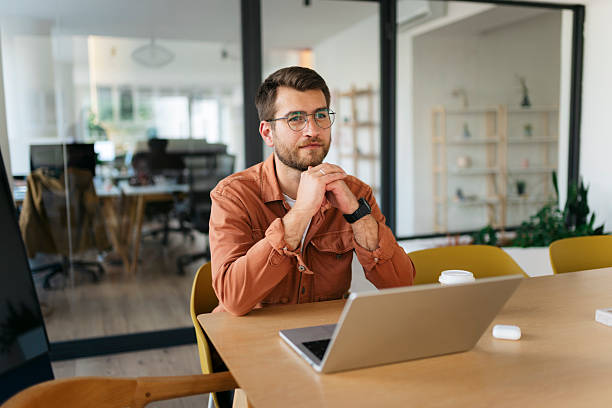 istock Young entrepreneur thinking at a business meeting 2238413242