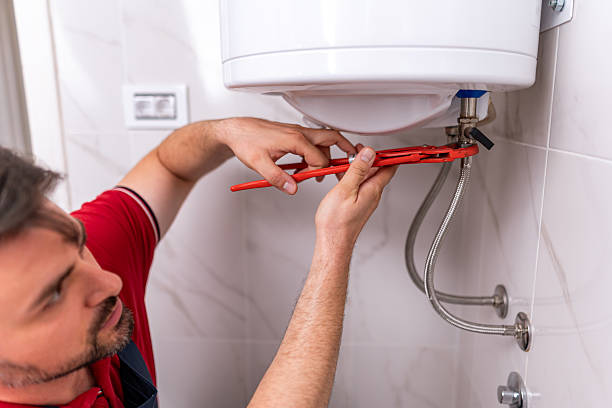 istock Plumber repairing hot water system in modern bathroom during daytime 2238413570