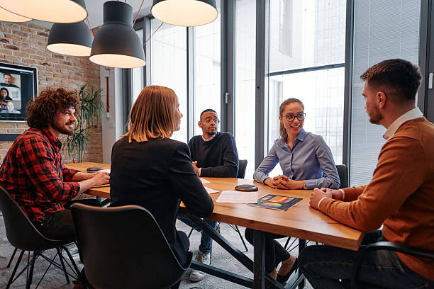 istock A diverse team of business professionals engage in discussions on various projects and develop new business strategies, epitomizing creativity and innovation in the entrepreneurial landscape 2238416054