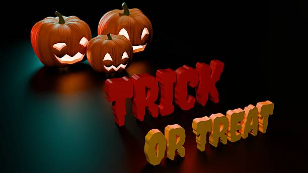 istock Glowing pumpkins above Trick or Treat orange and red glowing text 2238417764
