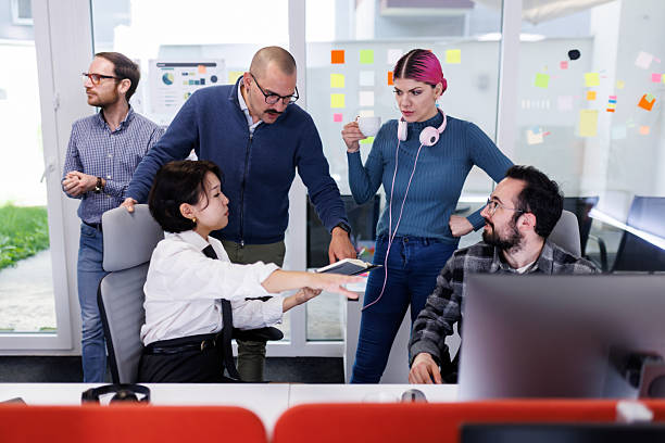 istock Team collaboration in a modern office setting during a business meeting with a focus on technology and teamwork 2238424289