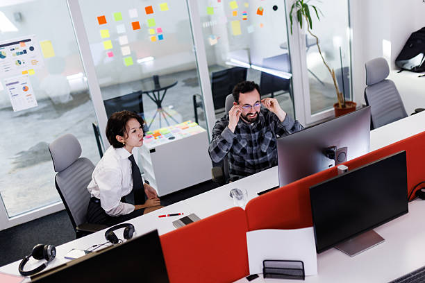 istock Business professionals collaborate in a modern office space during a brainstorming session focused on project development and strategy enhancement 2238424301