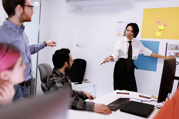 istock Business professionals engage in a collaborative meeting to discuss project updates and strategies in a modern office environment 2238424313
