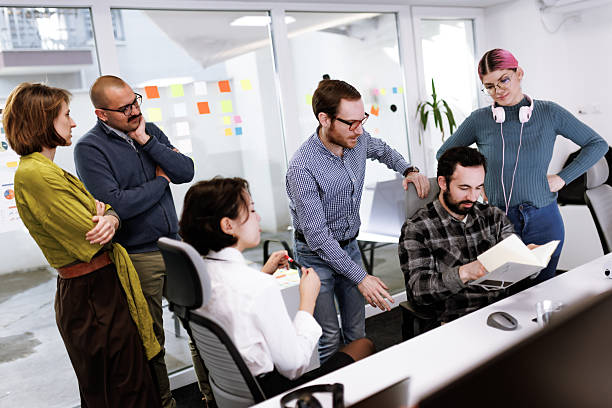 istock Business team collaborates on project ideas in a modern office space during a productive afternoon meeting session 2238424317