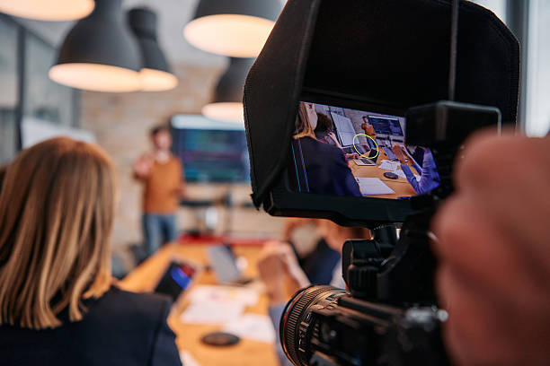 istock Capturing Corporate Dynamics: Videographer Films Business Meeting in Modern Office. 2238424808