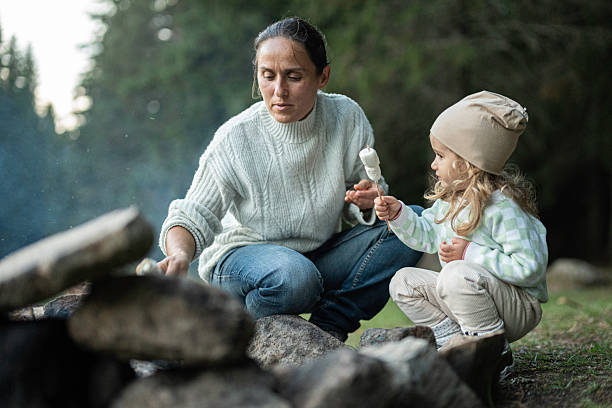 istock Family Camping Moments. Roasting Marshmallows On Campfire 2238426207