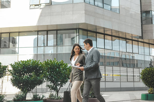 istock Professional Colleagues Walking Outside Corporate Building 2238428694