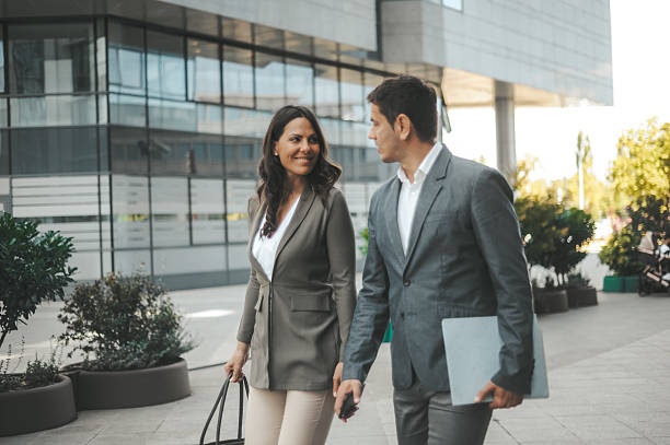 istock Business Colleagues Walking and Talking Outdoors 2238428703