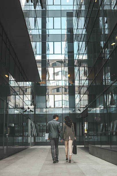 istock Business Colleagues Walking in Modern Glass Building 2238428730