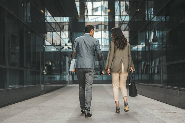istock Business Professionals Walking in Modern Urban Setting 2238428734