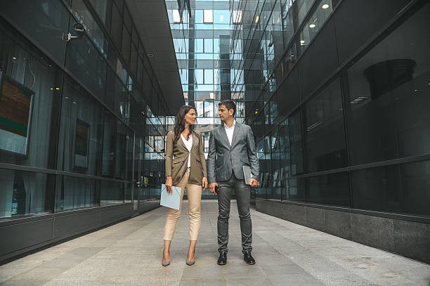 istock Business Colleagues Walking in Modern Urban Environment 2238428772