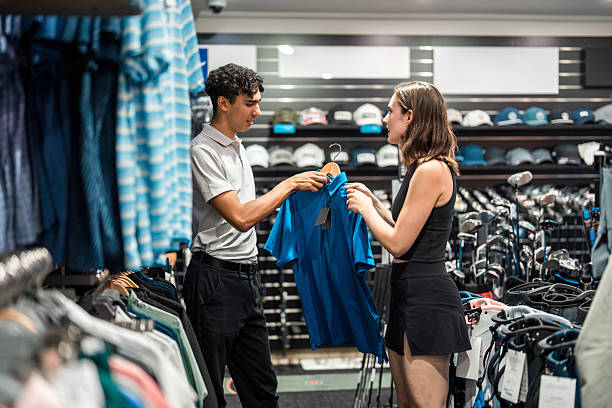 istock Diverse Couple Happily Shopping for Golf Attire 2238429440