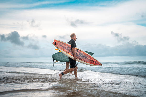 istock Energetic Surfing Duo on Gold Coast Beach Waves 2238429467