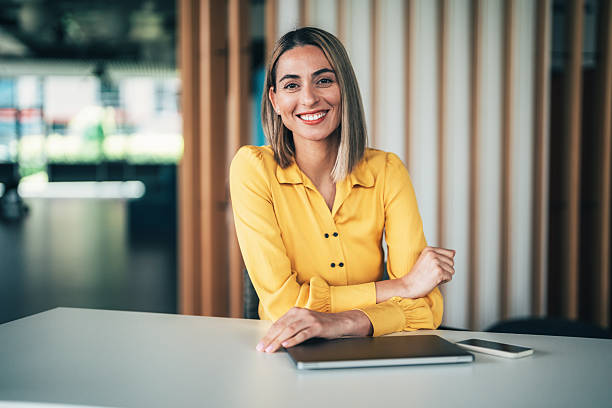 istock Beautiful woman smiling with crossed arms 2238436232