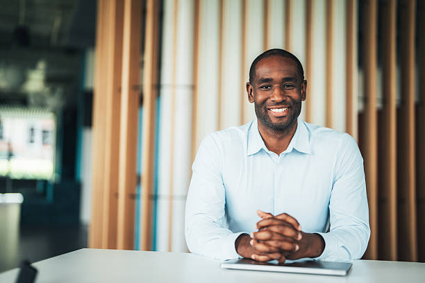 istock Confident business advisor sitting at desk in modern office 2238436264