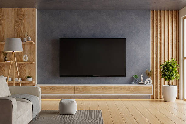 istock Modern and sleek living room interior featuring a large TV screen on a dark accent wall, surrounded by stylish wooden furniture- 3D rendering 2238436517