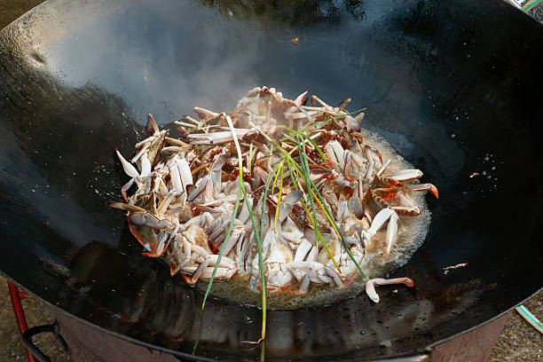 home-style stir-fried crab in a large wok