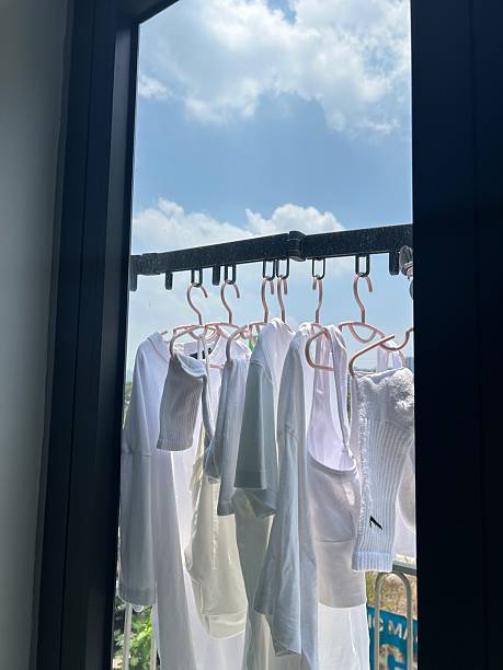 White Laundry Drying on a Balcony