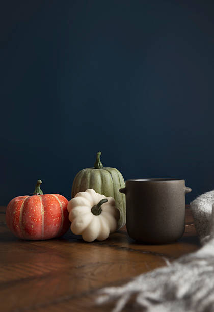 istock Moody autumn pumpkins on table with negative space 2238443616