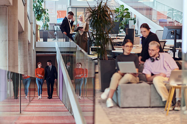 istock In a modern startup office, a diverse group of young professionals collaboratively tackles various business problems and challenges, surrounded by their engaged colleagues, fostering innovation and productivity 2238447732