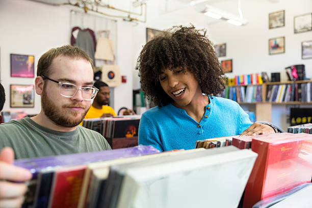 istock White Man and Multiracial Friend Browsing Vinyls inside a Record Store in Brooklyn, NYC 2238451138