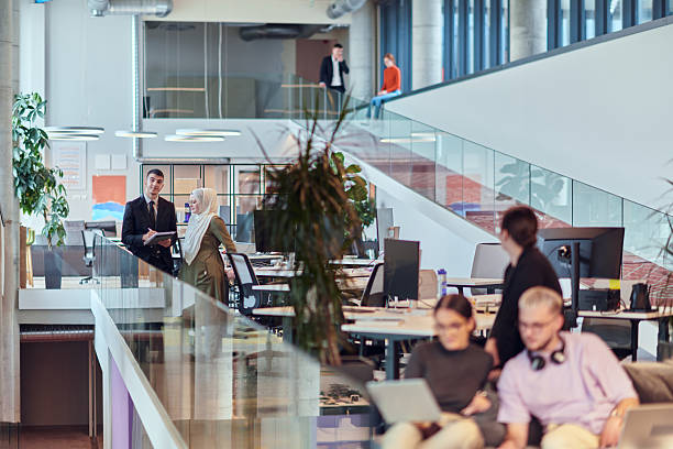 istock In a modern startup office, a diverse group of young professionals collaboratively tackles various business problems and challenges, surrounded by their engaged colleagues, fostering innovation and productivity 2238453065