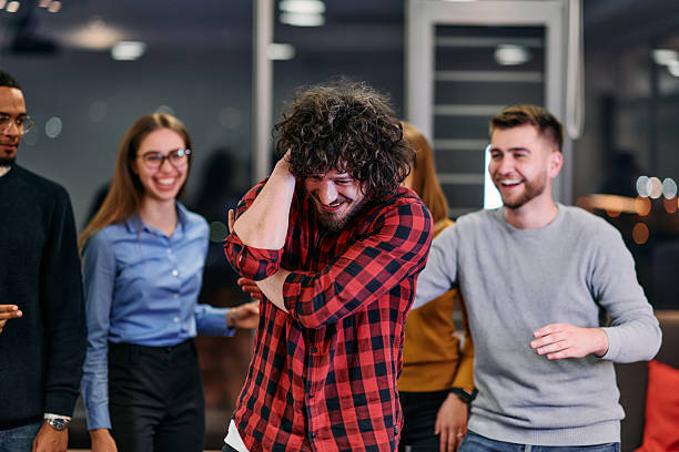 istock A group of young business people have fun playing interesting games while taking a break from work in a modern office. Selective focus 2238454479